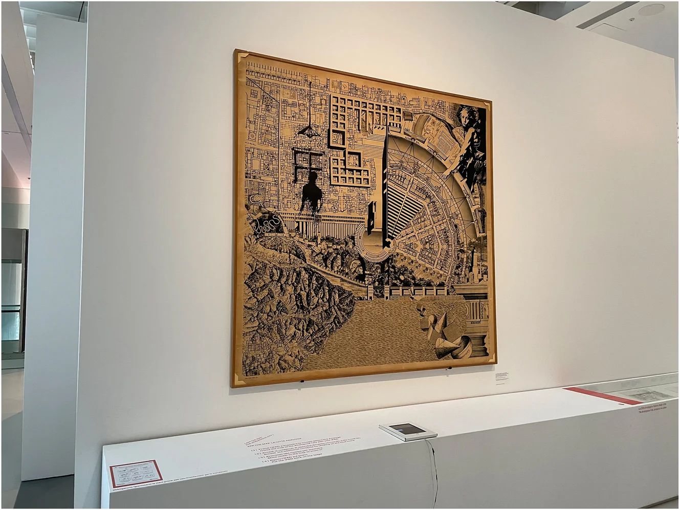 Figure 3. Digital installation of Aldo Rossi's La Città Analoga (the Analogous City) at MAXXI, Rome. The original 1976 collage – created with Eraldo Consolascio, Bruno Reichlin, and Fabio Reinhart – is displayed here alongside a tablet device that allowed visitors to explore the work's references and fragments through digital navigation. This hybrid presentation illustrates how Rossi's emblematic collage has been reinterpreted in physical-digital form, inviting new modes of exploration and participation. Photo: Courtesy of MAXXI.